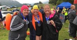 Northampton colleague completes wild swimming challenge in aid of two charities